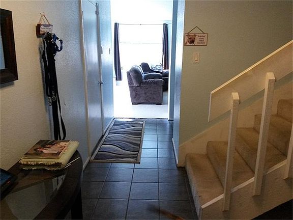 Entrance way with gorgeous new tile and plenty of light!