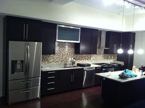 Modern kitchen with a 10 ft kitchen island and stainless ste
