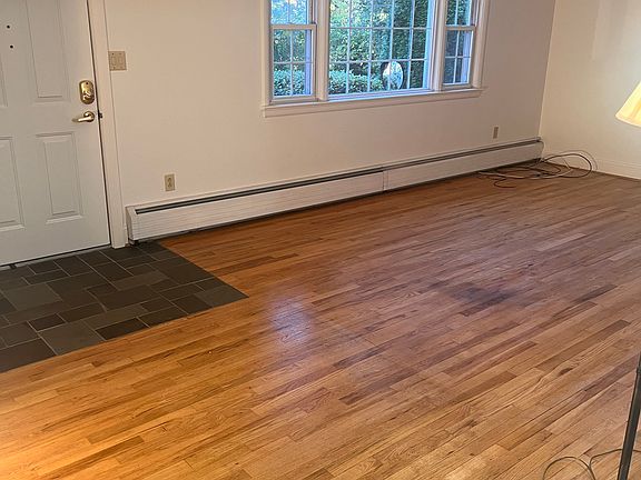 Living room with picture window and hardwood floors