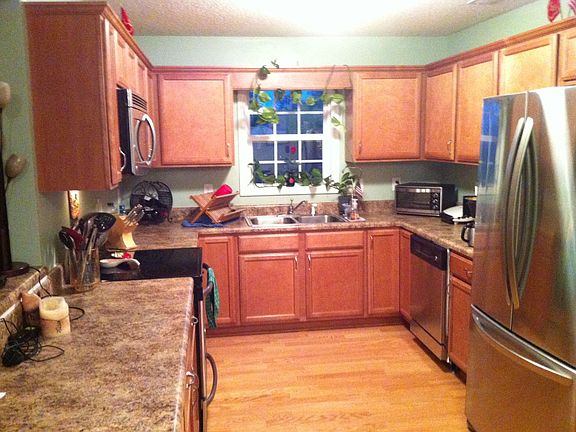 Big U-shaped, stainless kitchen