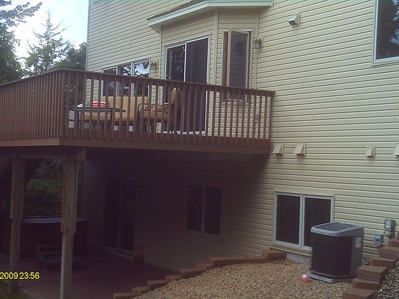 30' x 14' deck with stairs leading onto patio