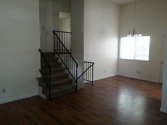 Spacious dining area offers a new light fixture.