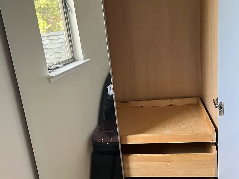 Additional closest #2 with mirror door and one of its two doors opened.