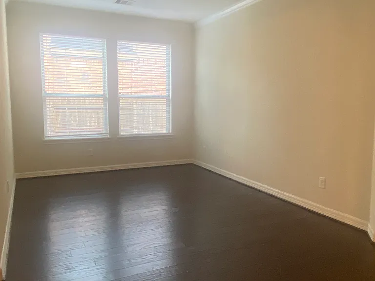 Elegant dining room featuring beautiful hardwood floors _ perfect for family meals and entertaining.