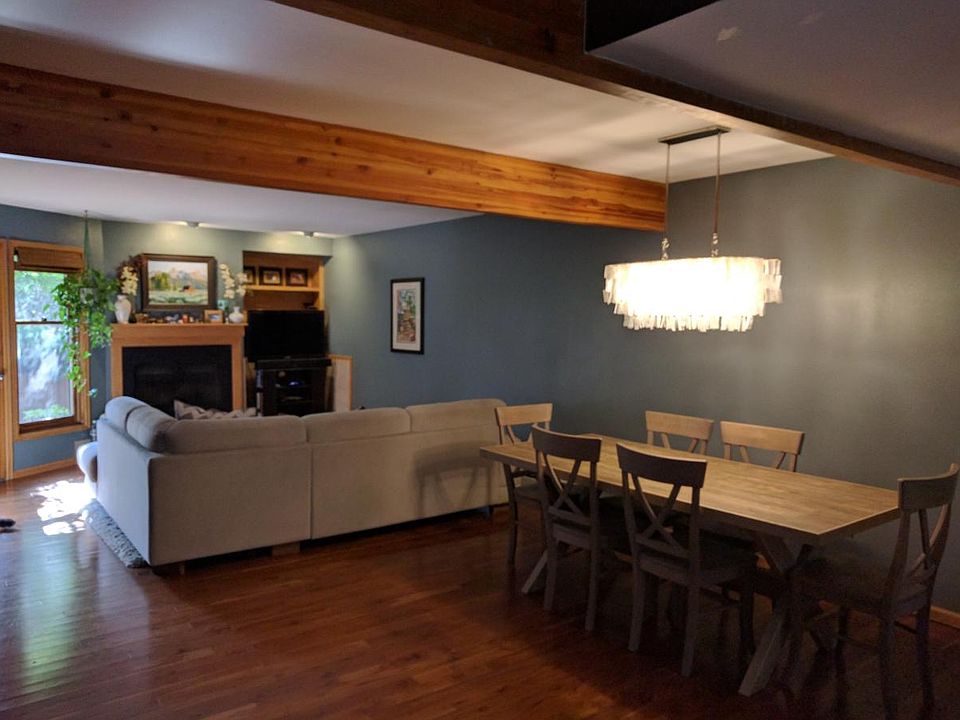 Living/Dining Open Floor Plan - has since been repainted white and floors are a modern light wash. Updated pics soon!