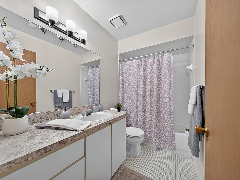 Spacious full bathroom at Eastwood Village Apartments in Clinton Township, MI.