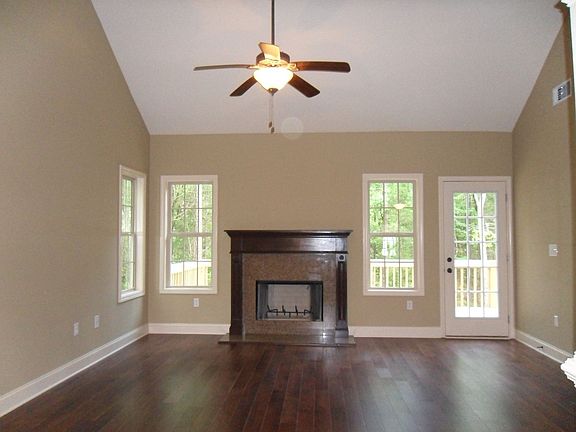 Vaulted family room with hard wood floors