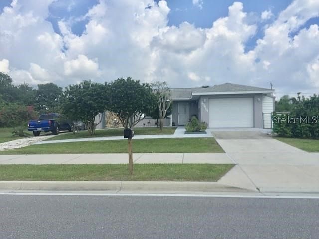 Block home with 2 bedrooms and 2 driveways across from Veterans Memorial Park