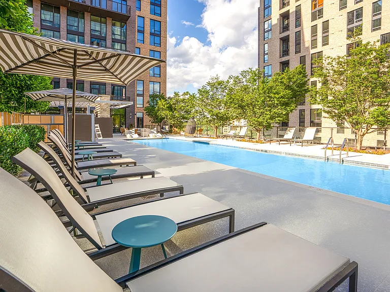 Resort-style saltwater pool with sundeck seating