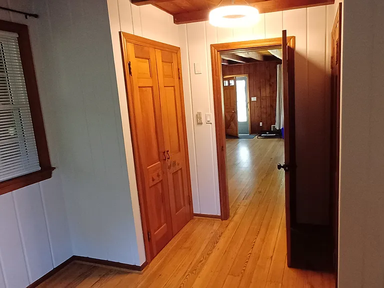 View from 1st floor bedroom to great room and entrance. Double closets left and right of bedroom door.
