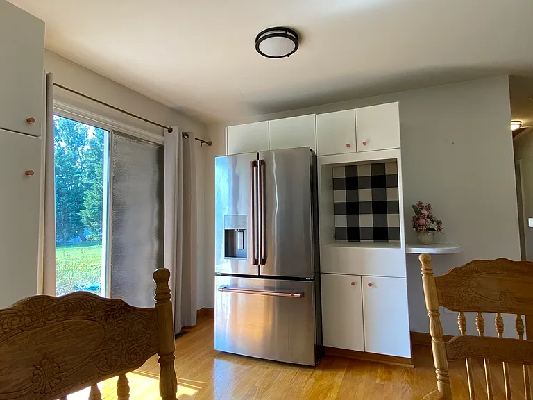 Another View of Kitchen w/ Sliders to Patio