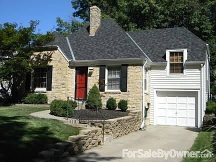 1610 Arapahoe St : Red original front door. Updated landscaping.
