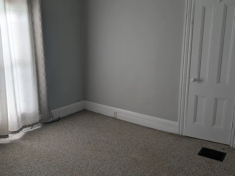 Second bedroom with carpeted floor, ceiling fan and small closet. Bedroom #2 size: 11 x 9.5.