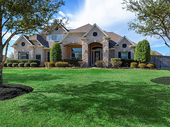 This beauty is nestled on 1/2 acre lot!
