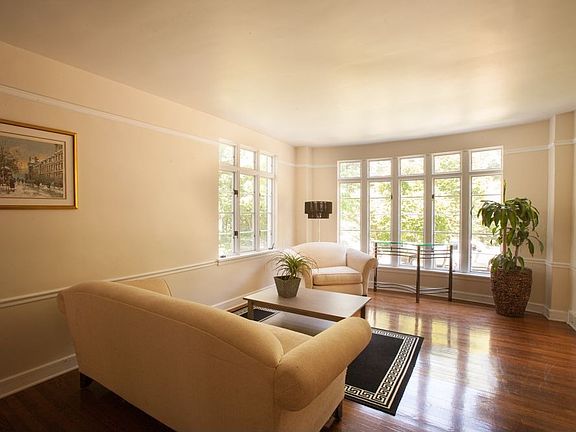 Living room with hardwood floor...