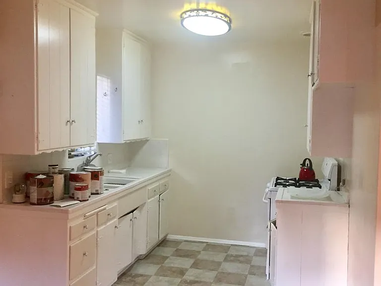 kitchen with stove and refrigerator