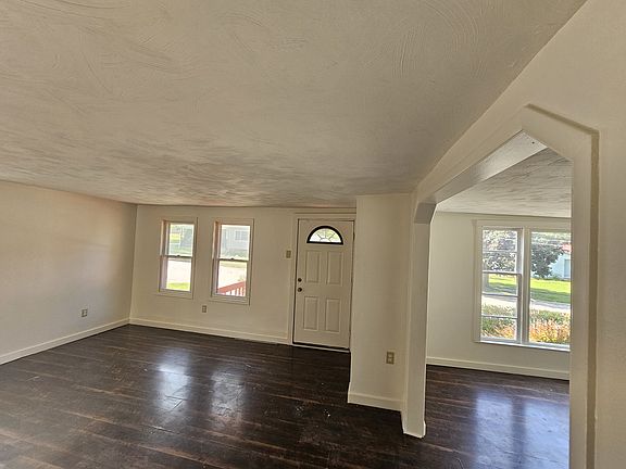 Living Room (left); Dining Room (right); front door (upper center)
