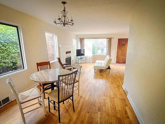 Spacious living area with beautiful hardwood floors. Living area can also be used for dining