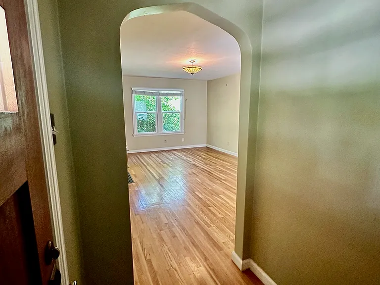 Dedicated entry with coat and shoe storage and unique archways