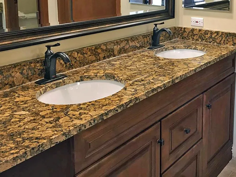 The master bedroom bath has a granite counter top with double sink.