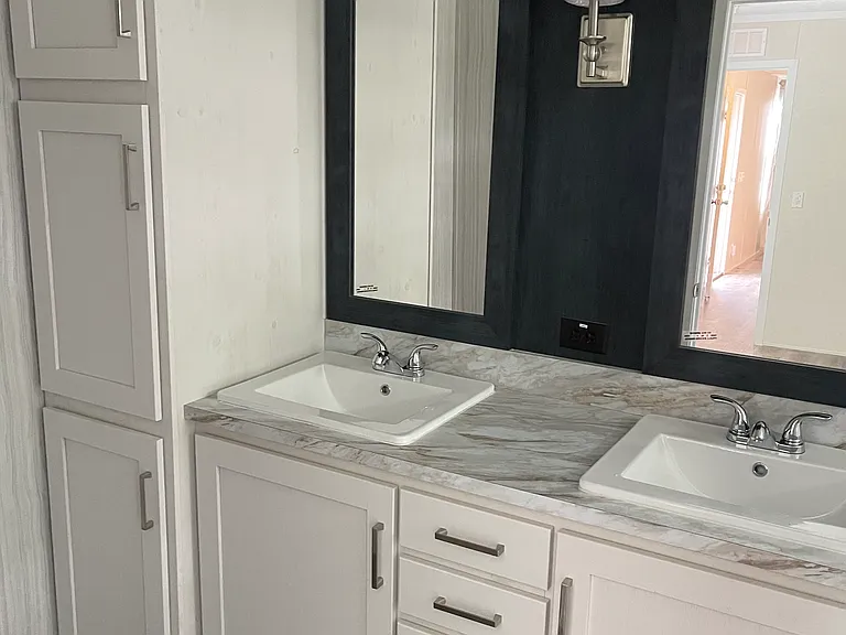 master bathroom with large linen cabinet