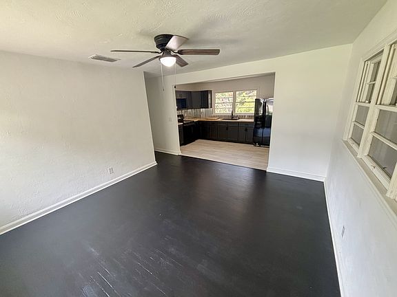 Living room looking into kitchen from front door