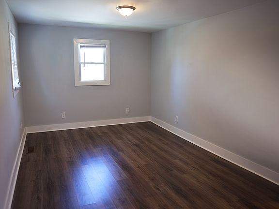Living Room feels OPEN, with windows on 3 sides!