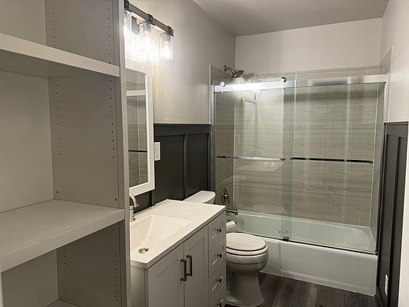 Large newly renovated main bathroom with plenty of storage.