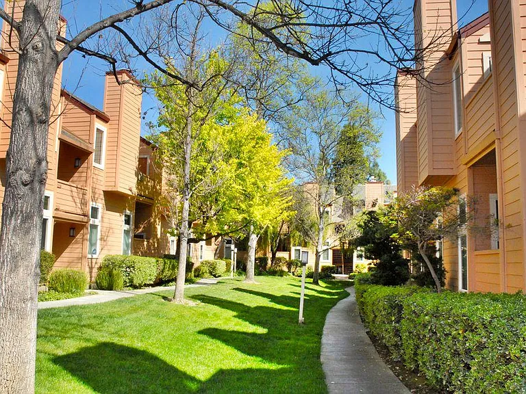 Top Floor, End Unit "Tree-House" in a Park Setting, tucked under trees, set back from the main street!!