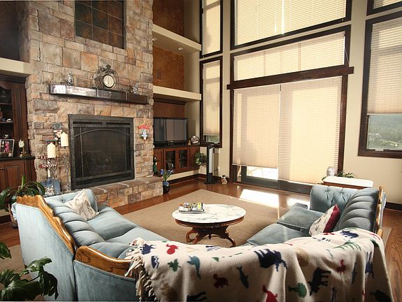 Living room with slate water fountain above fireplace.