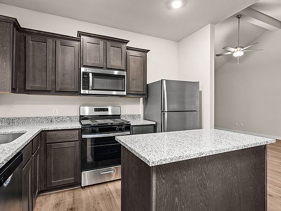 The kitchen of the Sabine has sprawling granite countertops.