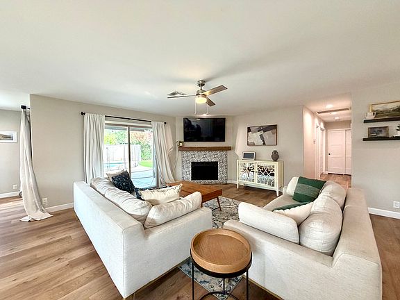 Inviting living space filled with natural light and direct views of the backyard and pool.