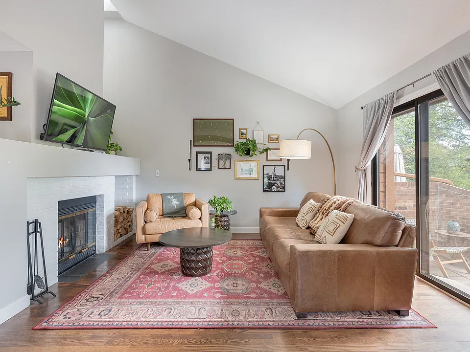 Living room with wood burning fireplace