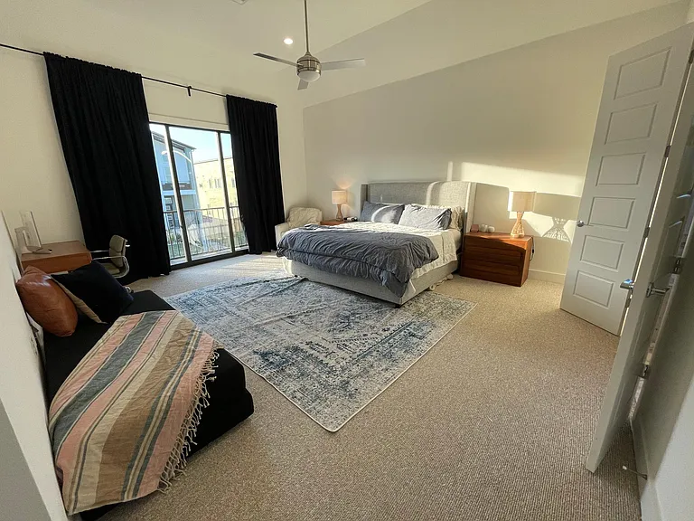 Primary Bedroom (3-panel Sliding Glass Door to front balcony)