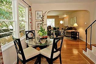 Cheerful dining area with gleaming hardwood floors