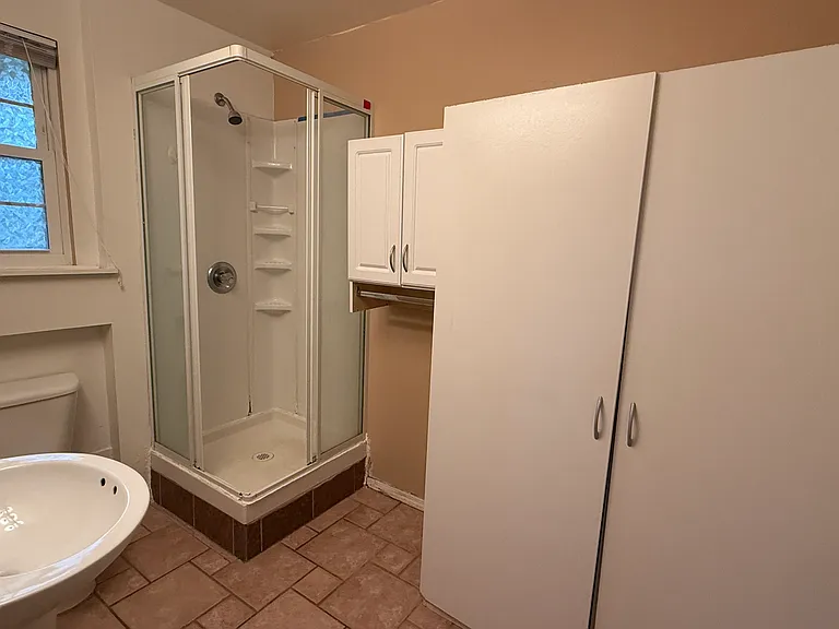 Efficiency apartment bathroom with storage