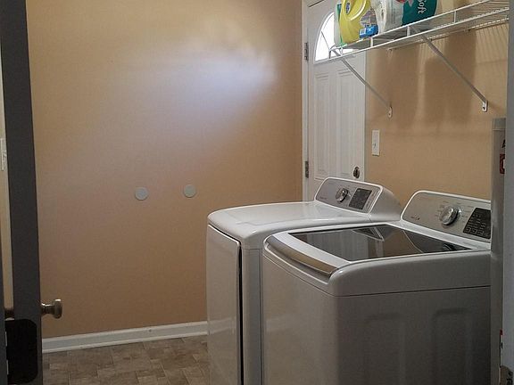 New appliances, paint, and flooring in laundry room