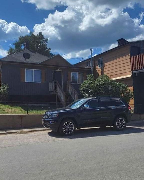 Front entrance with street parking.