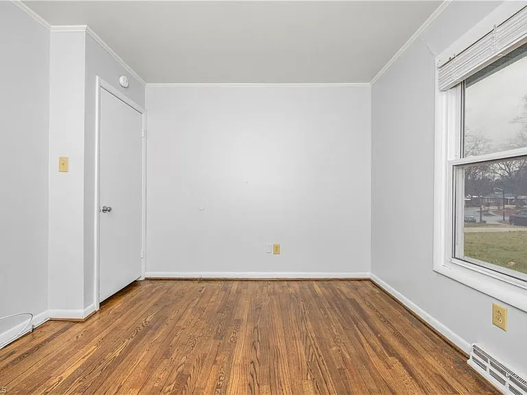 Bedroom two - window and door to hallway