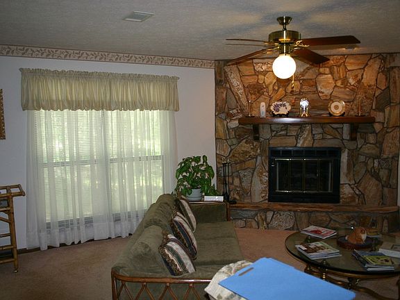 Living room with stone fireplace