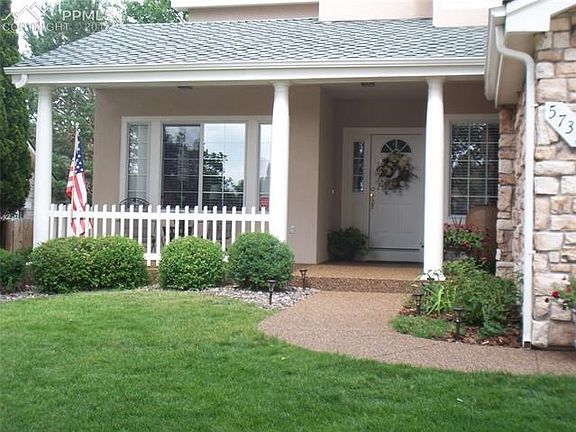 Warm and inviting front porch, with a high end pebble stone surface