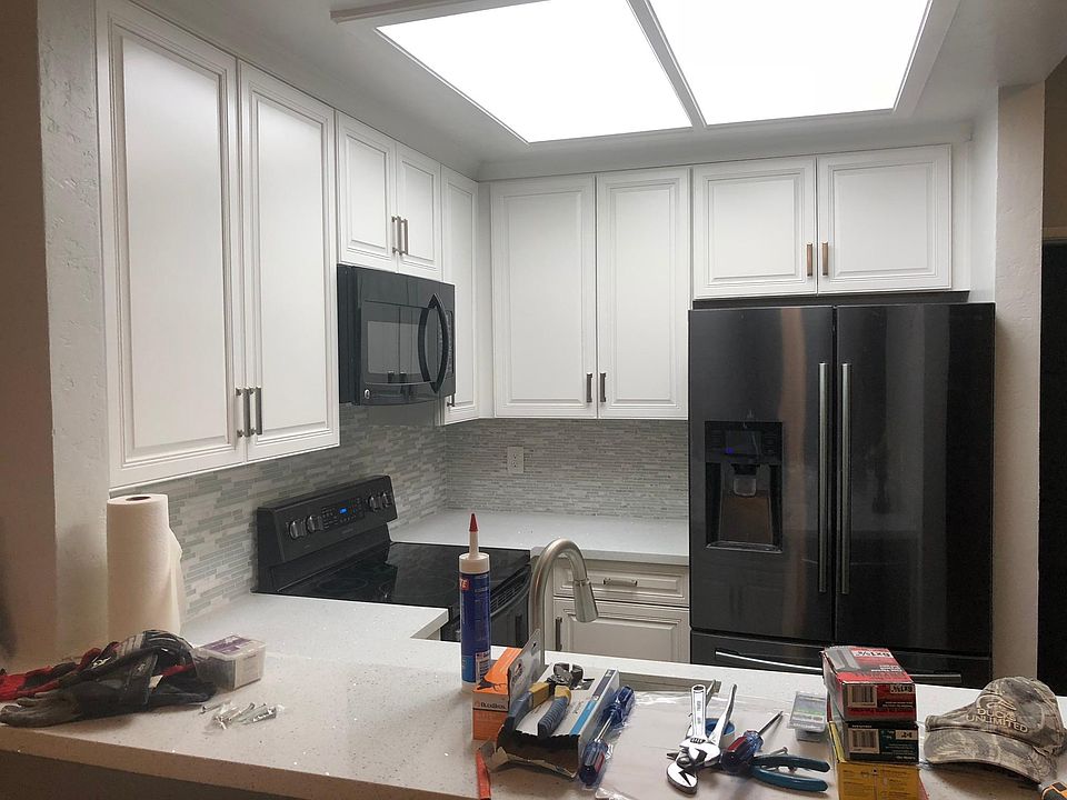 New kitchen, appliances, quartz countertops, and tile backsp