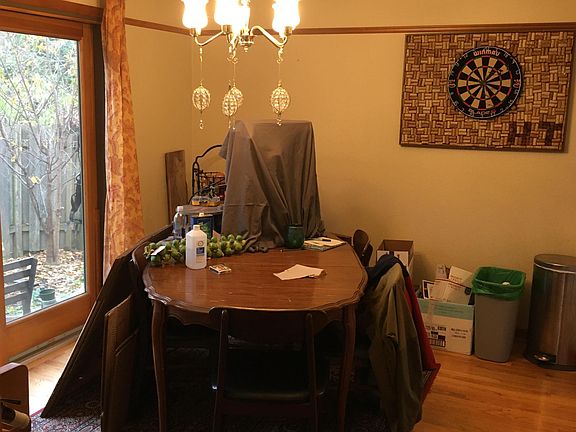 Dining room with hardwood floors and sliding doors to outdoor patio and private space.