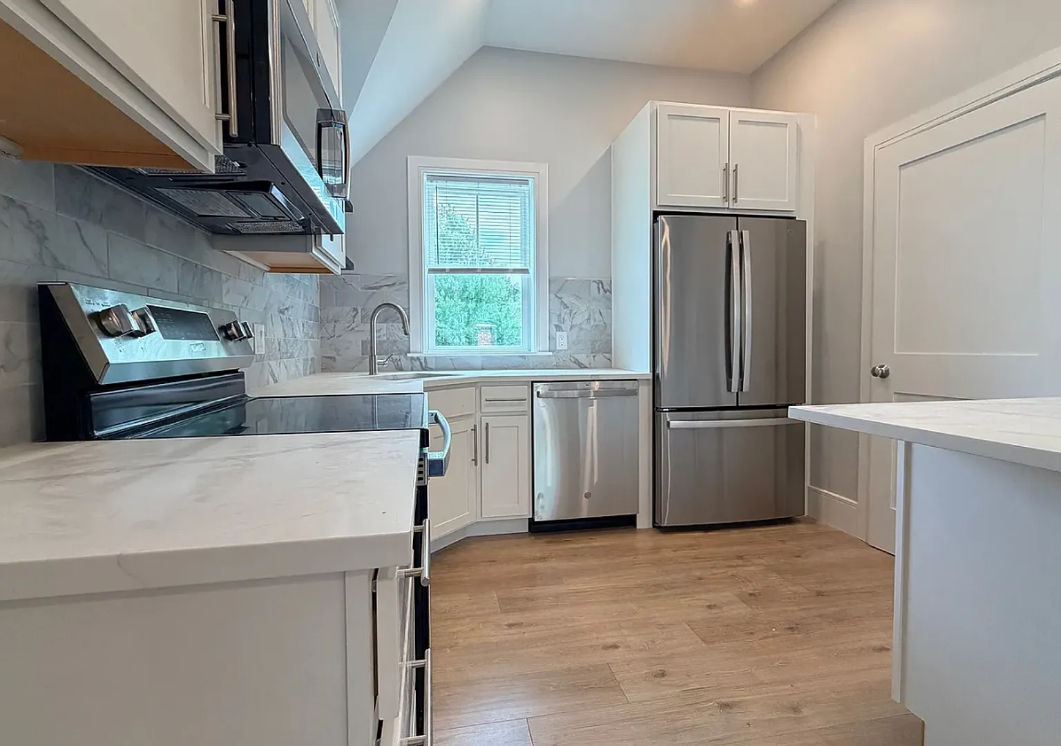 Brand New Construction in Perfect Location! Laundry in Unit, Centralized Heating and A/C! Pro Man... — Photo 1