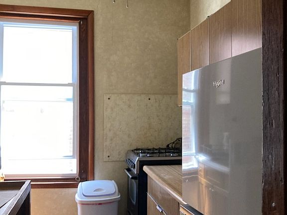 Kitchen with new refrig, gas stove, lots of cabinet space.