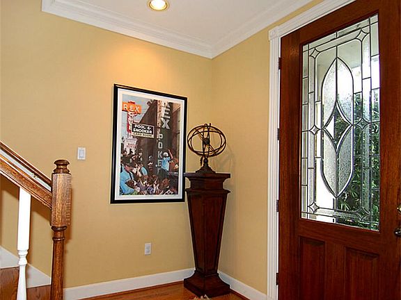 Lovely front door entryway. Contemporary earthy colors throughout.