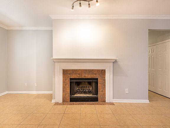 Open concept living room with a wood burning fireplace