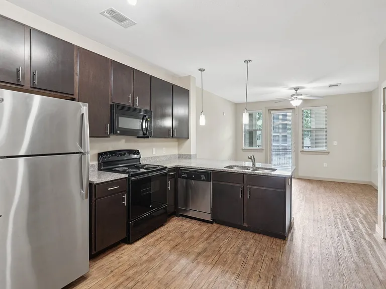 Spacious Upgraded Kitchen Appliances and Cabinets at District at Medical Center, San Antonio