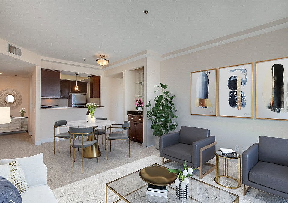 Staged and carpeted living room.