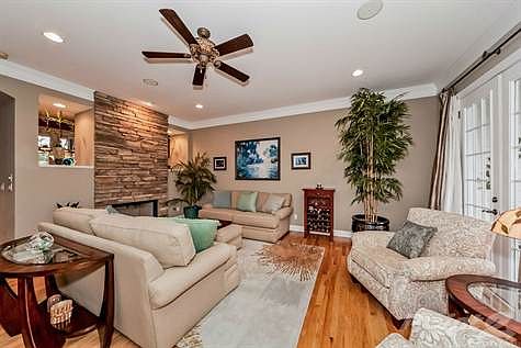 In the living room, your attention is immediately drawn to the marvelous stacked stone fireplace, which is complete with interchangeable glass rocks!